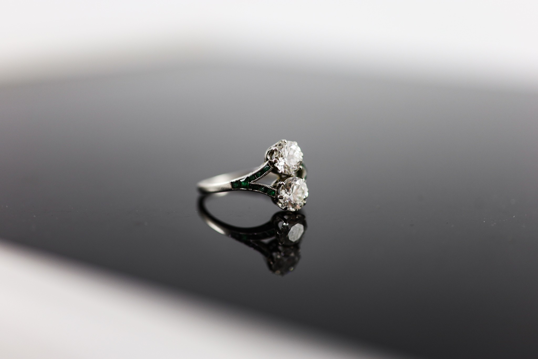A 1920's platinum and two stone diamond ring